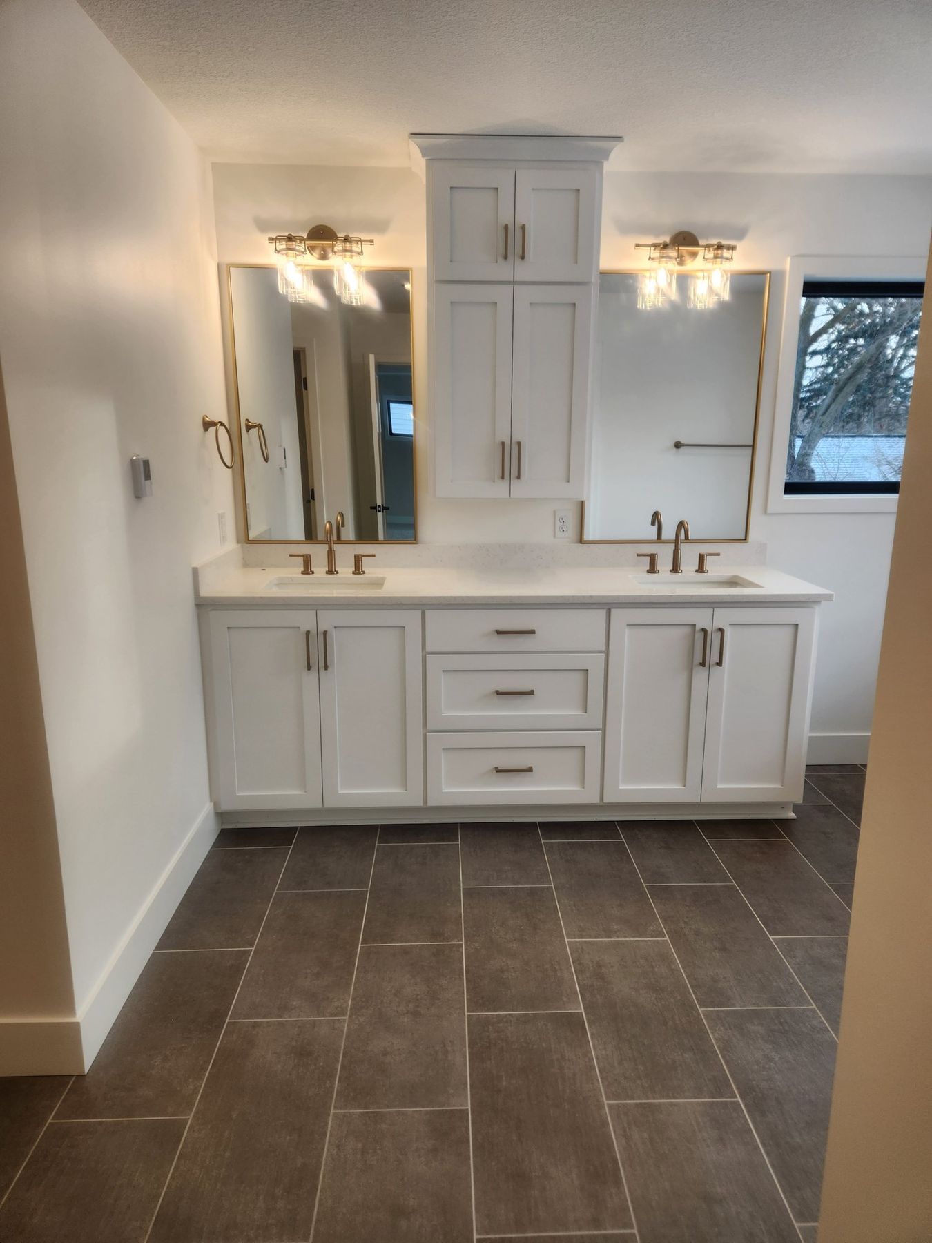 Primary bath vanity and linen cabinet