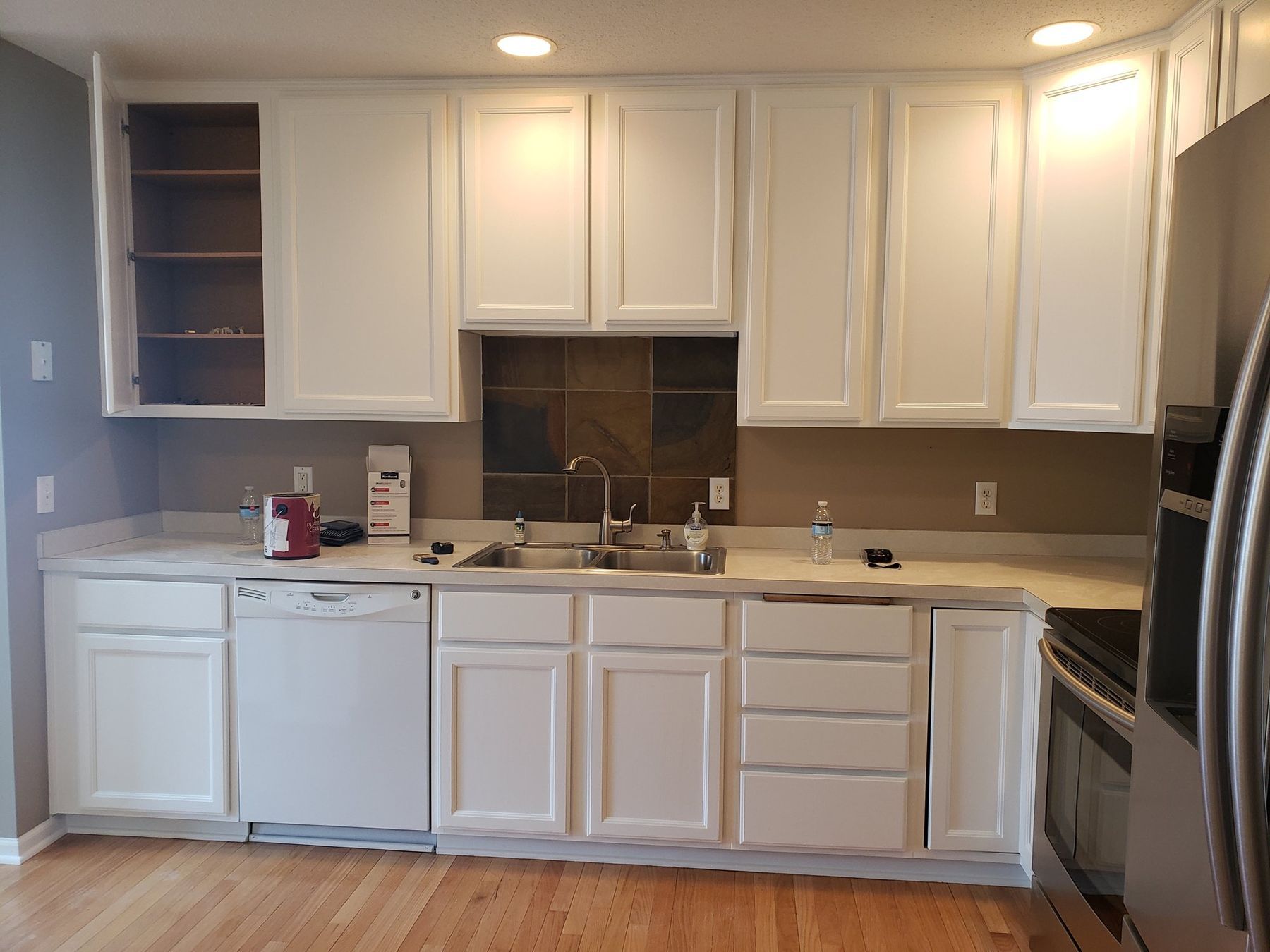 Sink wall with white painted cabinets