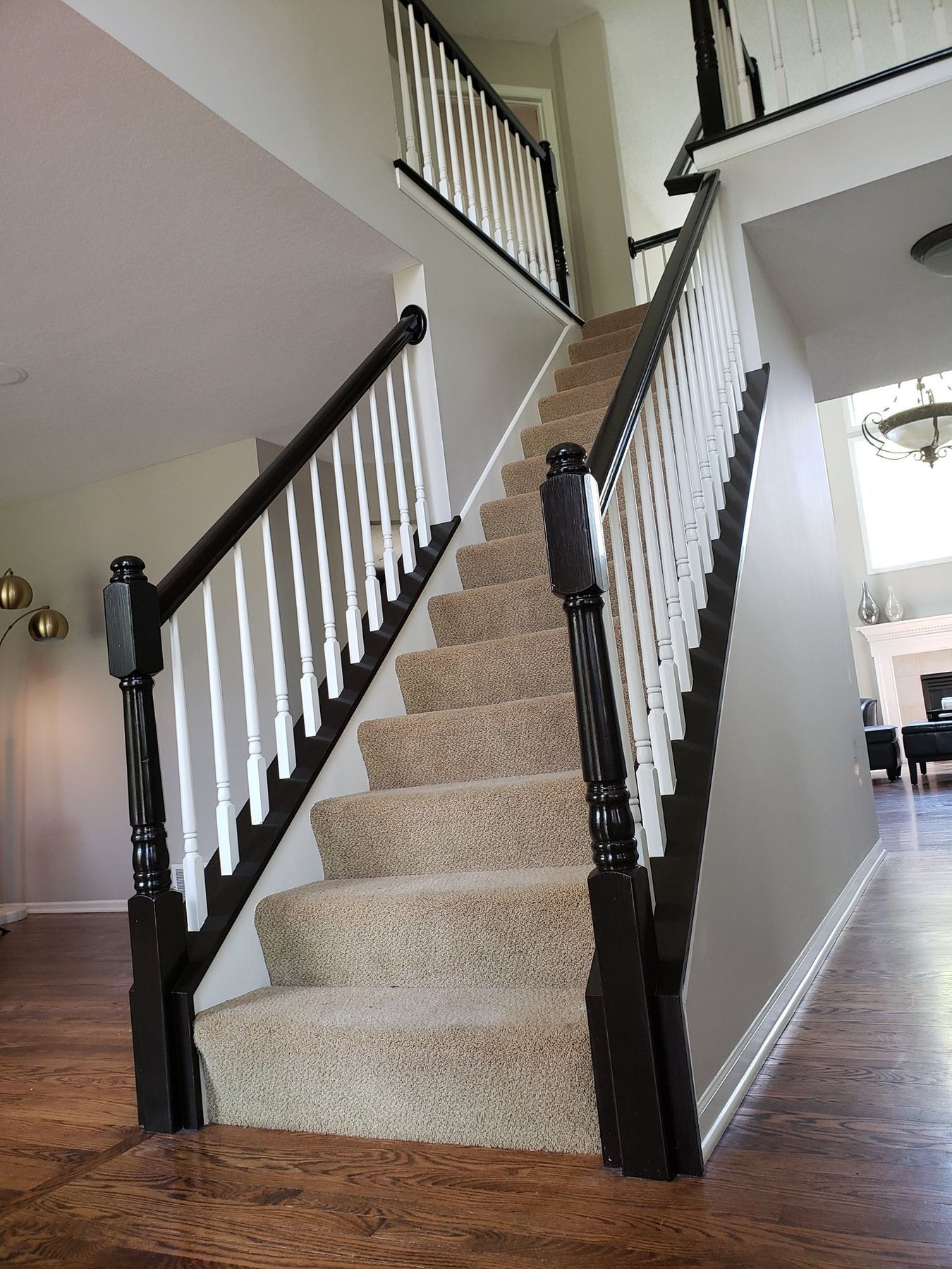 Newel post and handrail refinished