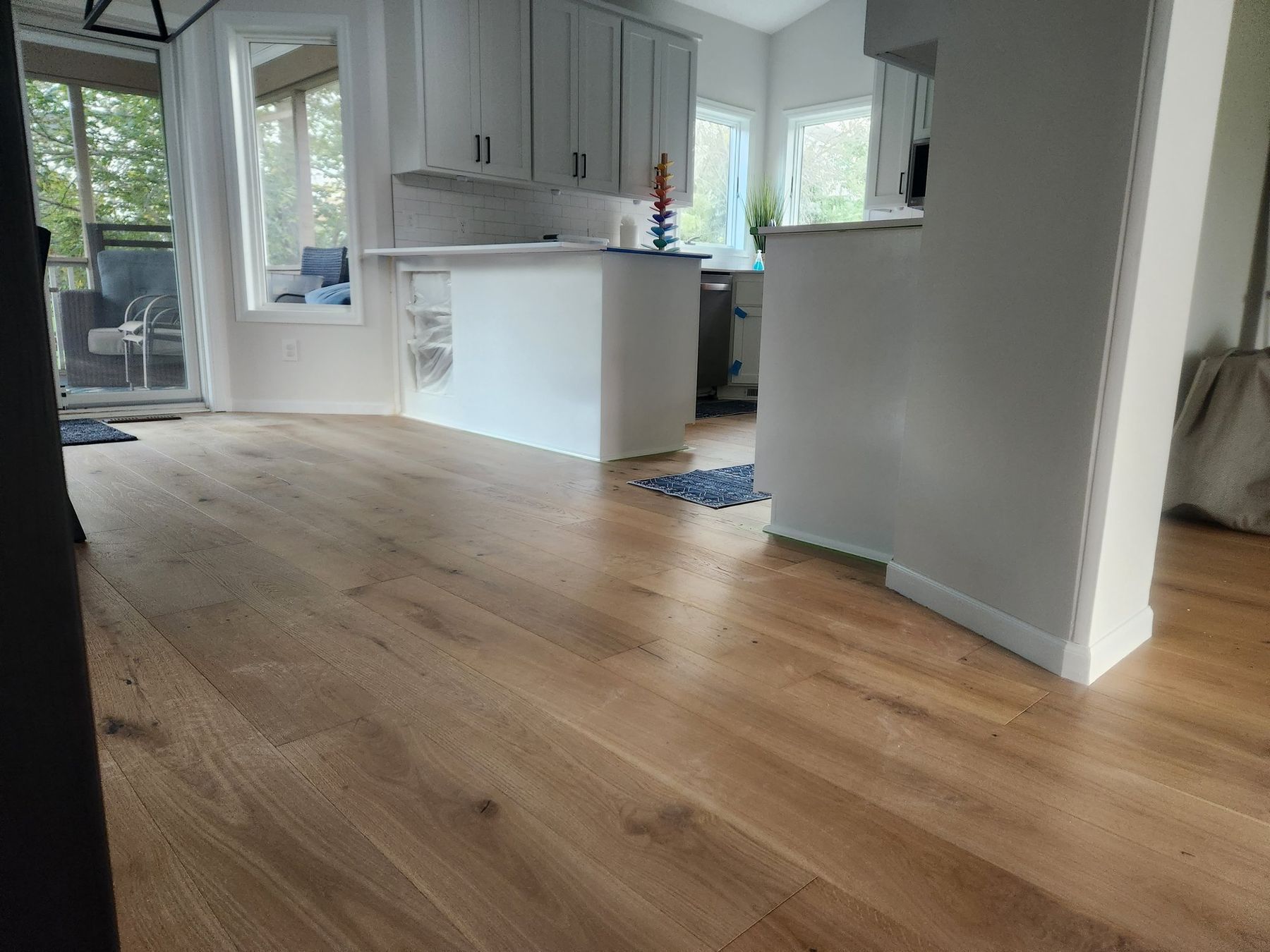 Kitchen and dining area with white-painted trim and island after the golden oak conversion