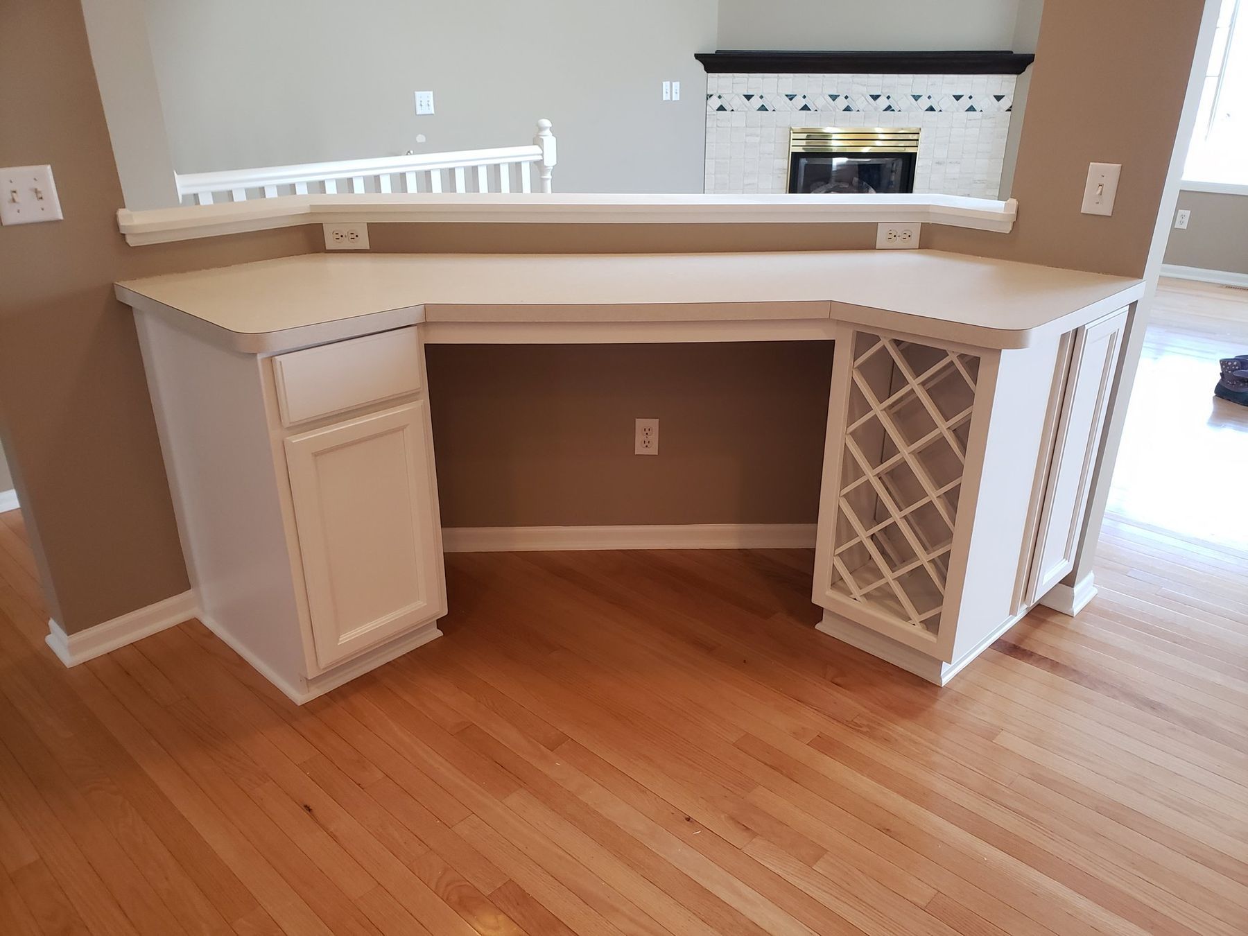 After: Built-in desk and wine rack: golden oak to white