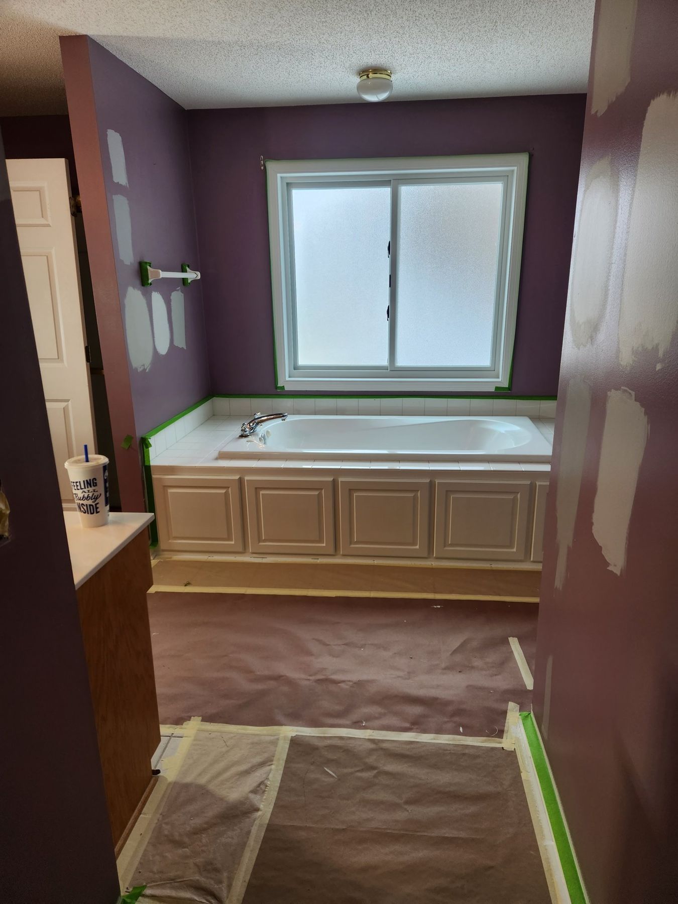 Tub and bath floor masked before painting